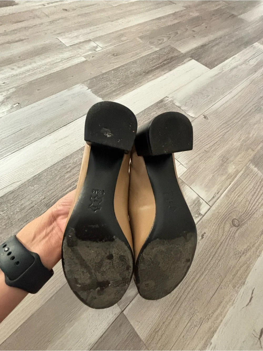 Tory Burch Two-Tone Tan and Black Cap-Toe Pumps with Gold Logo